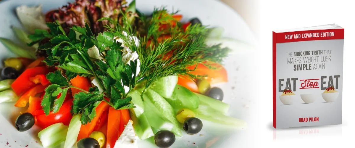 Plate of salad with Eat Stop Eat logo and Book. The original '2 day diet' and intermittent fasting. 